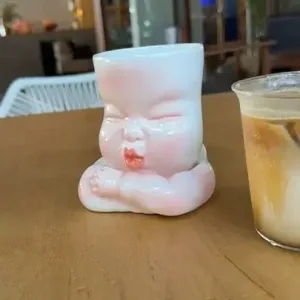 Whimsical Ceramic Smooch Mug-this hand-painted mug features a cute puckered face ready for a shy kiss.