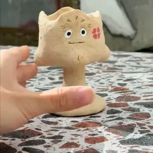 Jester's Many Faces Fragrance Holder-this handmade fragrance holder features four faces depicting joy, anger, sorrow, and happiness