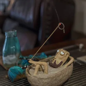 Bathing Zen Monk Clay Figurine-This handmade clay incense burner features a lounging monk blowing smoke from his mouth with an exaggerated, unbothered expression.