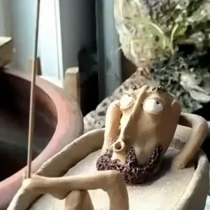 Bathing Zen Monk Clay Figurine-This handmade clay incense burner features a lounging monk blowing smoke from his mouth with an exaggerated, unbothered expression.