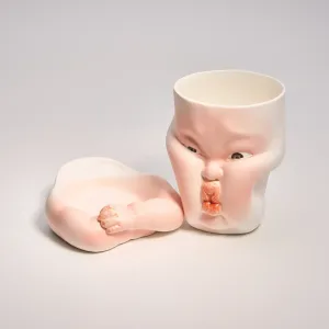 Whimsical Ceramic Cheeky Pinch Mug-this hand-painted mug features a chubby cheek being pinched in a gesture of affection
