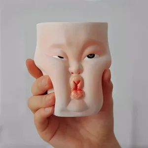 Whimsical Ceramic Cheeky Pinch Mug-this hand-painted mug features a chubby cheek being pinched in a gesture of affection