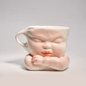 Whimsical Ceramic Cheeky Pull Mug-this hand-painted mug captures a playful moment with the mouth corner being pulled