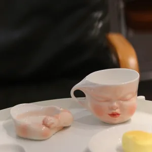 Whimsical Ceramic Cheeky Pull Mug-this hand-painted mug captures a playful moment with the mouth corner being pulled