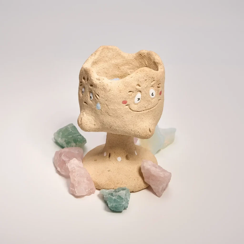 Jester's Many Faces Fragrance Holder-this handmade fragrance holder features four faces depicting joy, anger, sorrow, and happiness