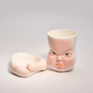 Whimsical Ceramic Pouty Mug-this hand-painted mug features a quirky pouting expression with twisted lips