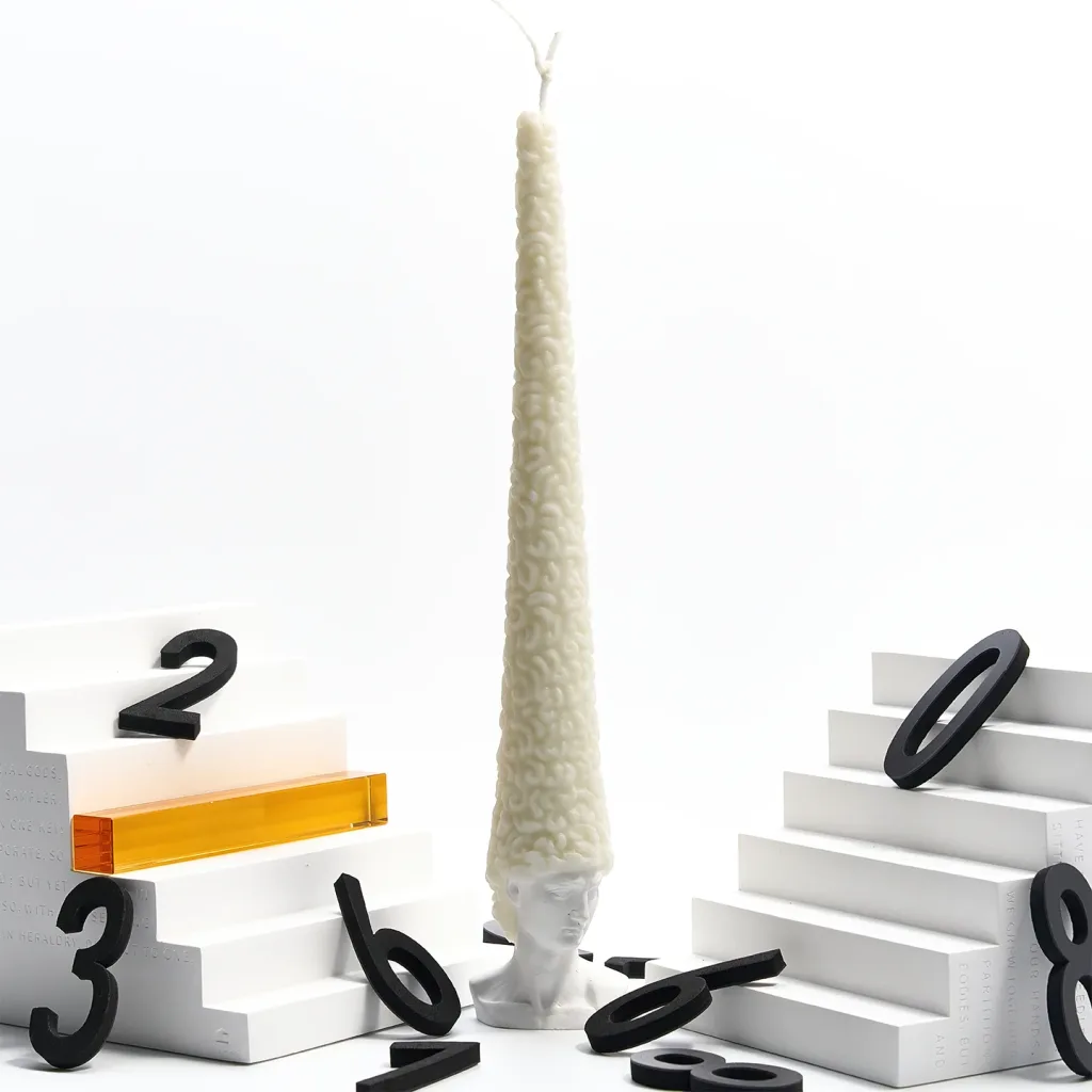 Bald David Bust Scented Candle–The scented candle's wax 'hair' slowly melts away as it burns