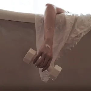 Dumbbell Soap-wash your body and "train" your biceps at the same time.