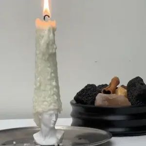 Bald David Bust Scented Candle–The scented candle's wax 'hair' slowly melts away as it burns