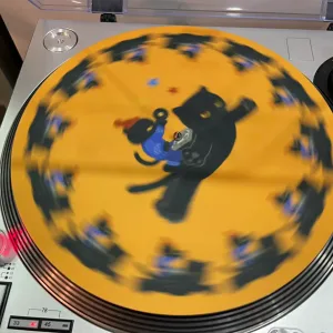 Retro DJ Cat Vinyl Slipmat-this feline spins hypnotically along with your favorite tracks