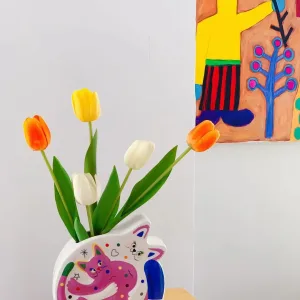 Hugging Cats Vase-A playful ceramic vase featuring two hugging cats covered in colorful doodles
