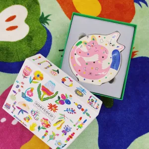 Hugging Cats Vase-A playful ceramic vase featuring two hugging cats covered in colorful doodles