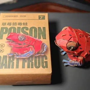 Strawberry Poison Dart Frog Paper Model-Bring the rainforest to your desk by assembling this vibrant, lifelike frog from 127 pieces of eco-friendly kraft paper