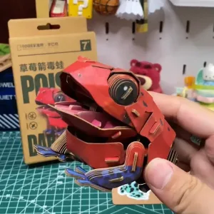 Strawberry Poison Dart Frog Paper Model-Bring the rainforest to your desk by assembling this vibrant, lifelike frog from 127 pieces of eco-friendly kraft paper
