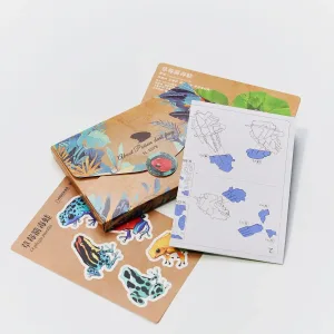 Strawberry Poison Dart Frog Paper Model-Bring the rainforest to your desk by assembling this vibrant, lifelike frog from 127 pieces of eco-friendly kraft paper