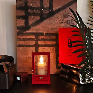 Cinematic red door Candle Holder-Inspired by The Odyssey, this red gate features a textured optical lens that transforms candlelight into a dreamy, cinematic ripple.