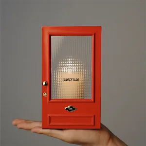 Cinematic red door Candle Holder-Inspired by The Odyssey, this red gate features a textured optical lens that transforms candlelight into a dreamy, cinematic ripple.