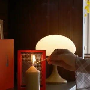 Cinematic red door Candle Holder-Inspired by The Odyssey, this red gate features a textured optical lens that transforms candlelight into a dreamy, cinematic ripple.